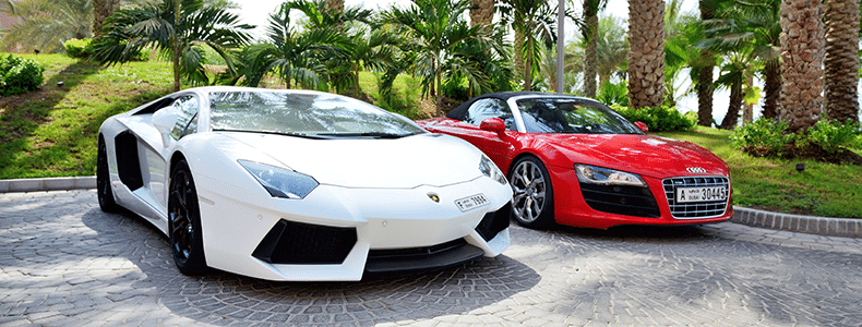 white and red luxury cars ready for interstate shipping